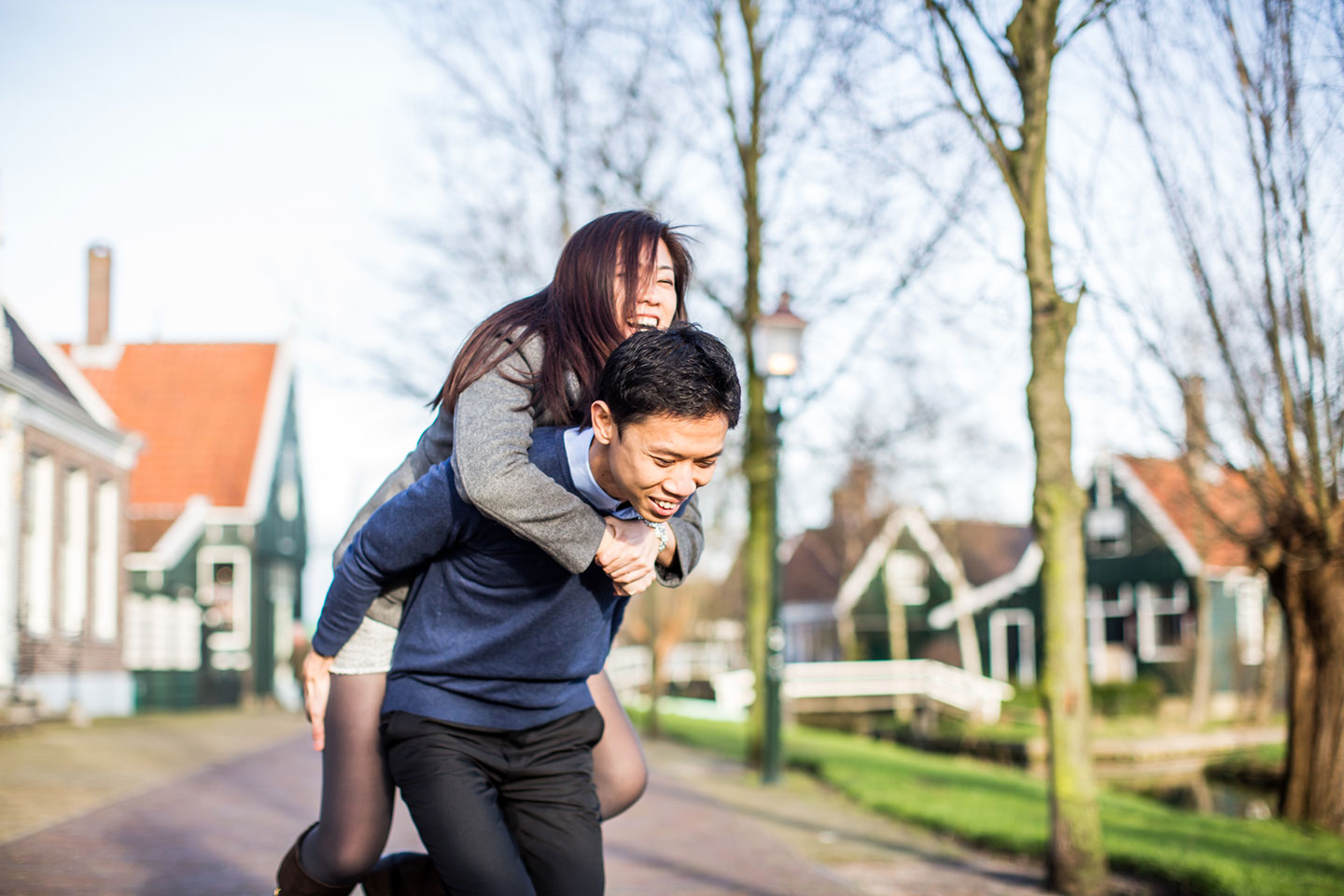 Asian couple having fun during their pre-wedding shoot in the Netherlands