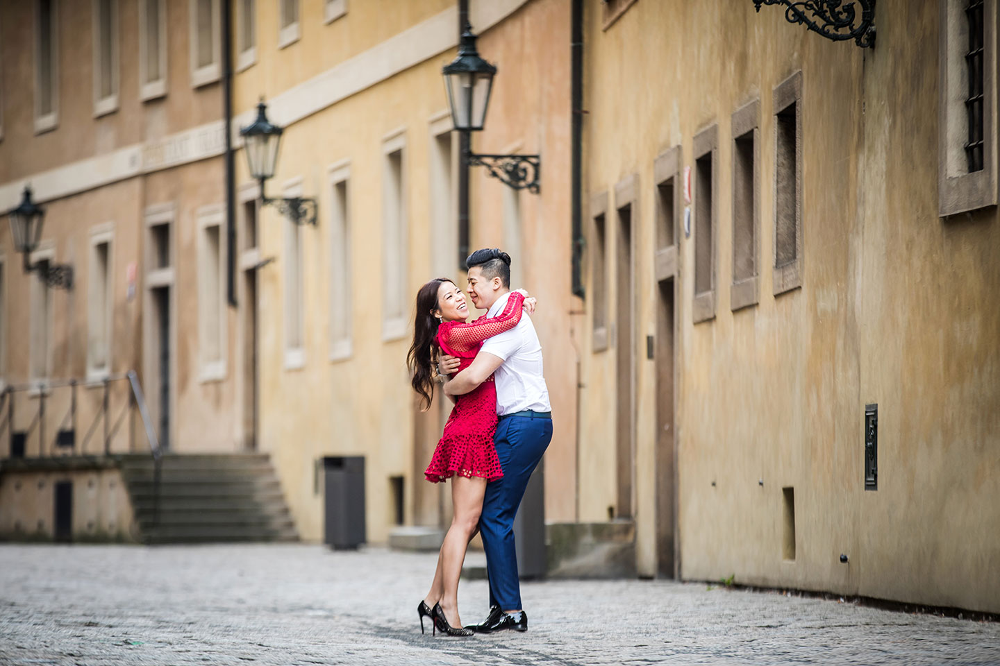 Couple during their engagement shoot in the streets of Prague